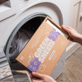 lavender laundry sheets uk 64 load pack being opened in front of a white washing machine