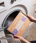 lavender laundry sheets uk 64 load pack being opened in front of a white washing machine